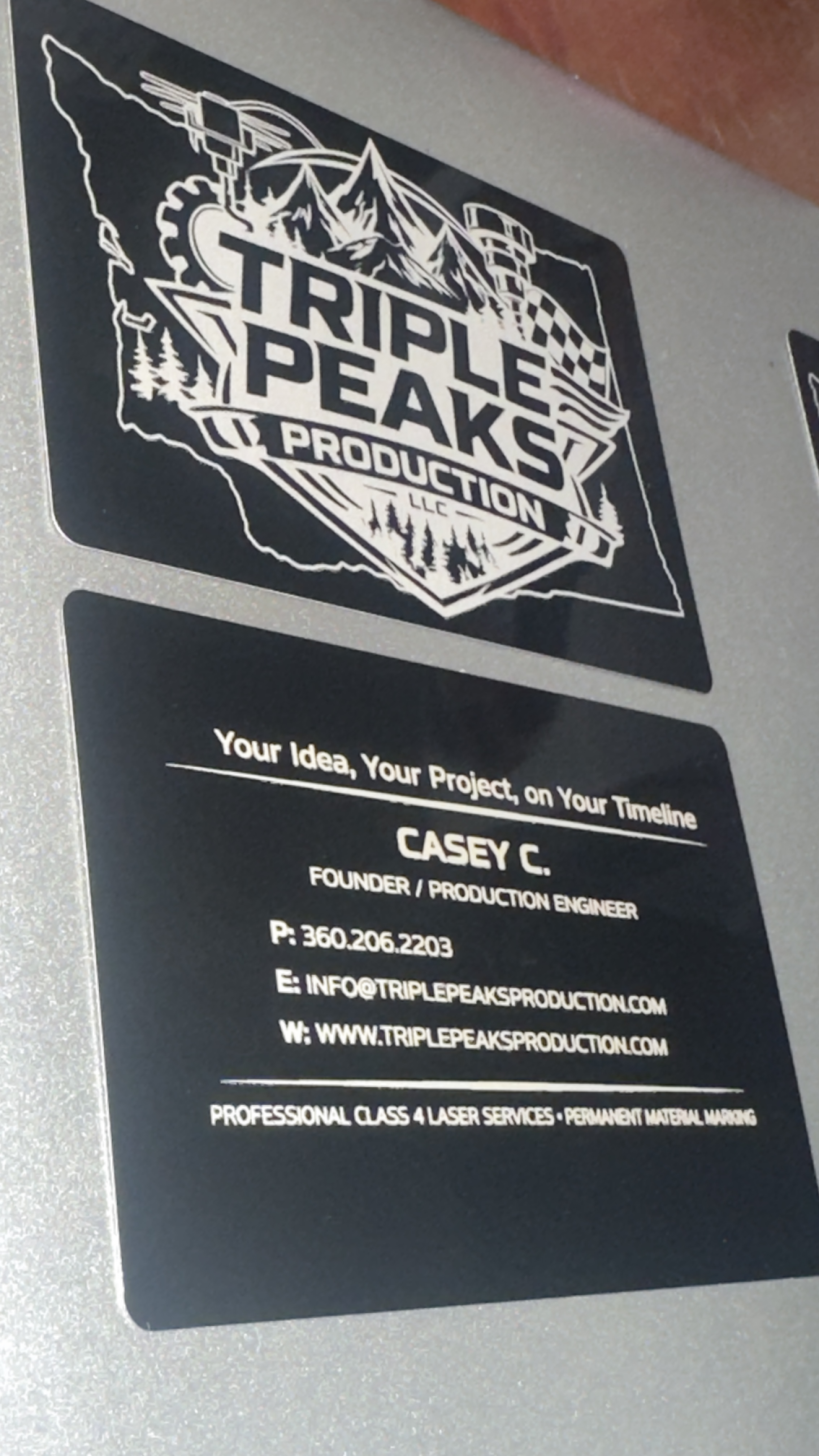 Triple Peaks Production metal business card front logo and back contact info