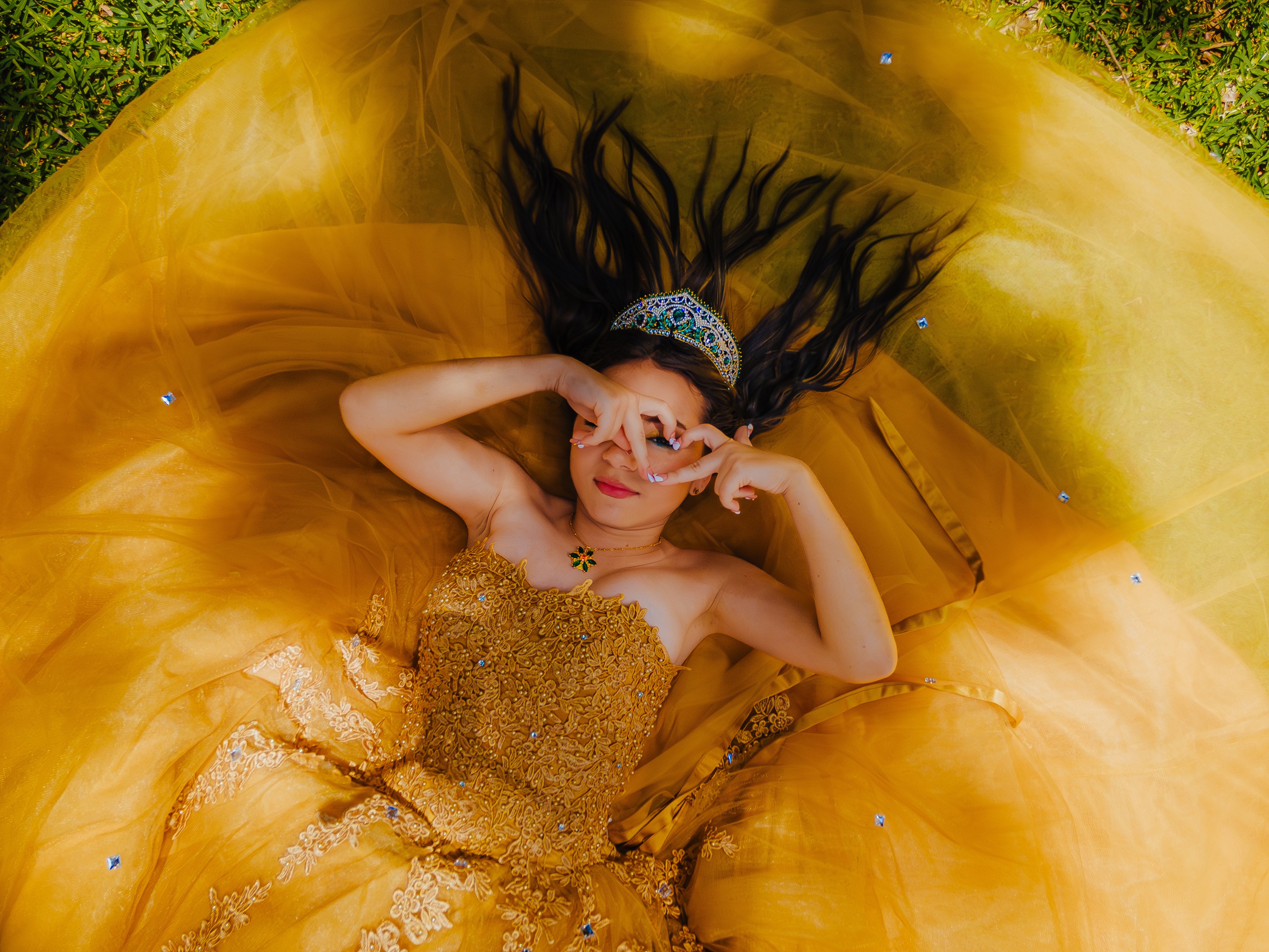 Quinceañera drone shot in gold dress