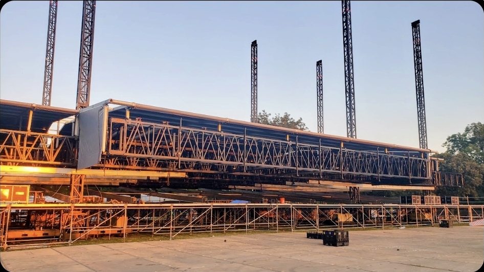 Stage roof truss going up at golden hour