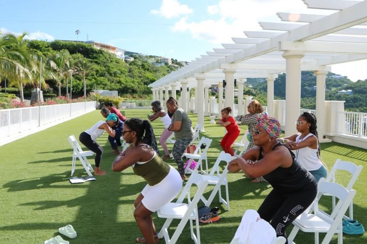 Women doing outdoor fitness on rooftop terrace in the Virgin Islands