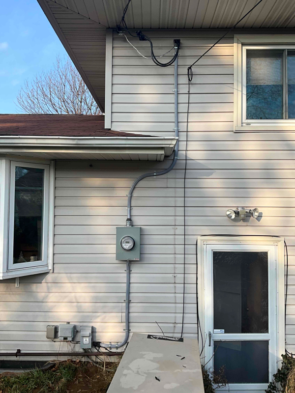 Completed exterior service entrance upgrade with new conduit riser and meter base โ Monroe County residential, Premier Alarms and Electric