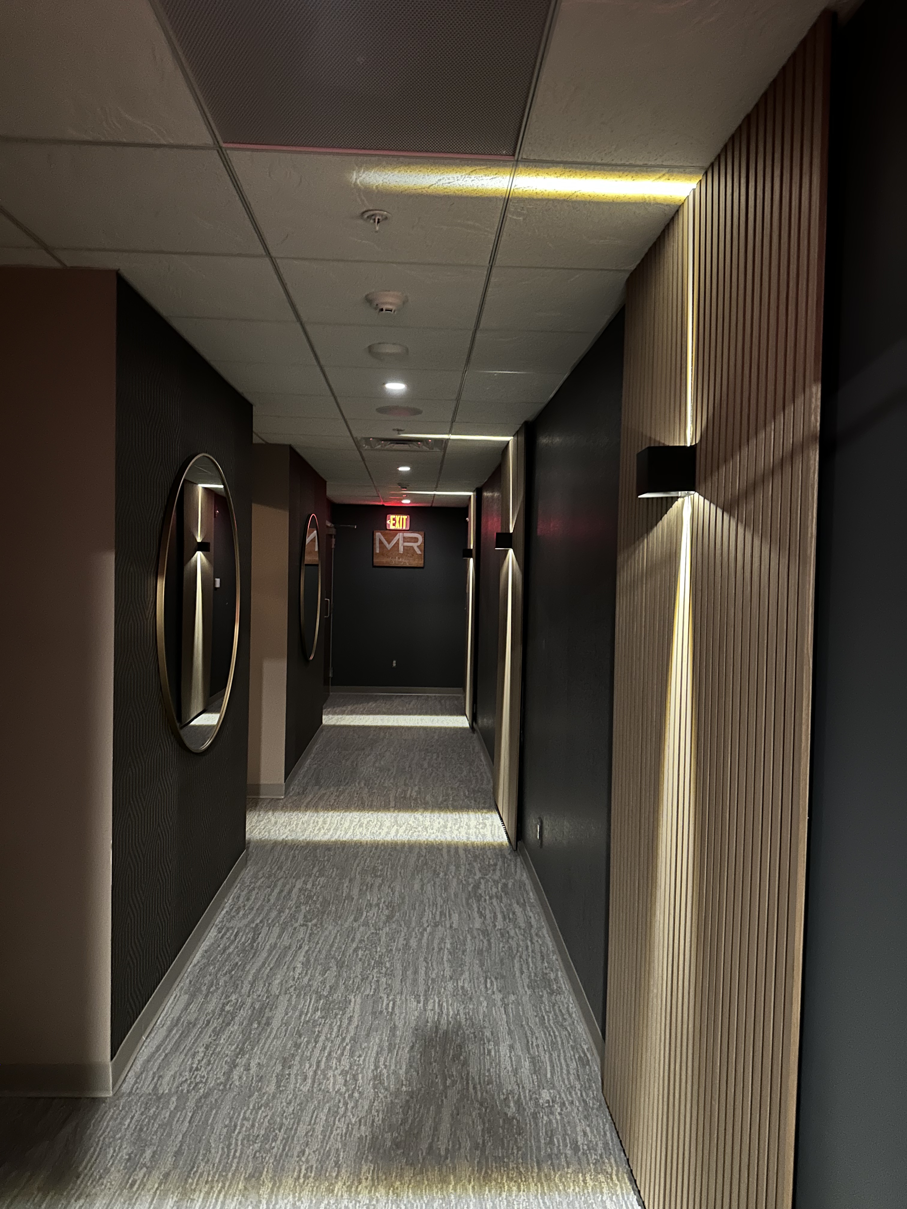 Upscale commercial hallway LED cove lighting and wall sconces by Premier Electric Rochester NY
