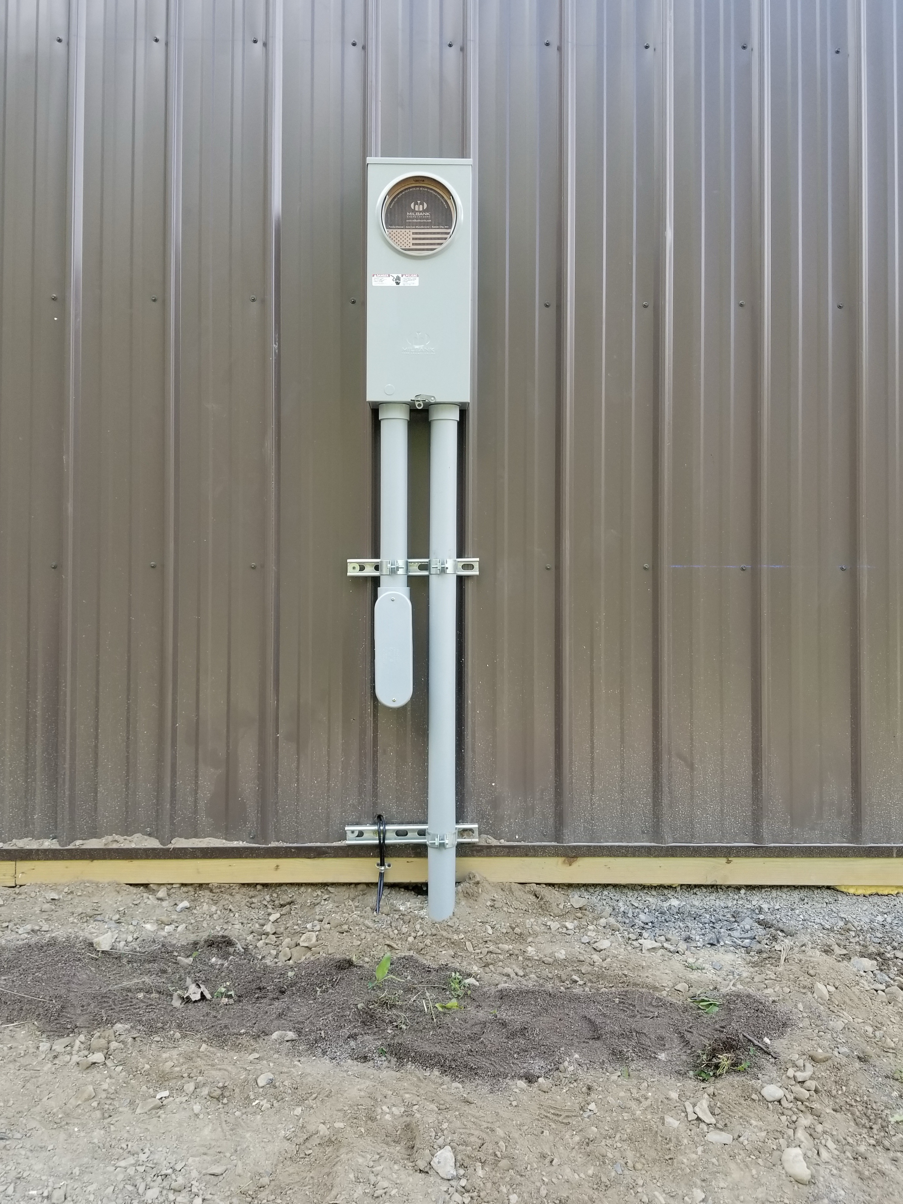 New meter base and service entrance installation on metal agricultural building — Monroe County NY, Premier Alarms and Electric