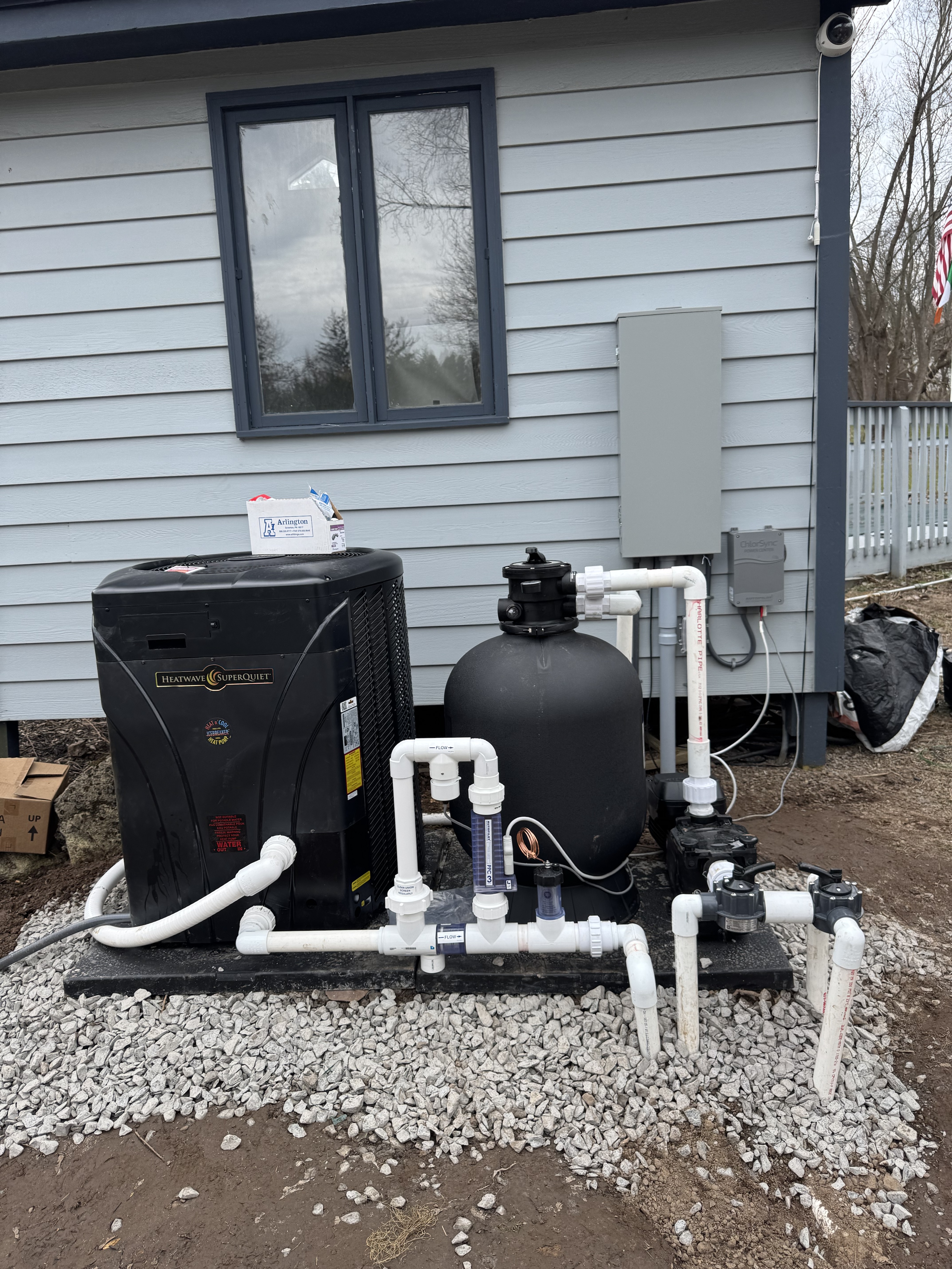 Complete pool equipment pad installation with HeatWave heat pump, sand filter, and electrical subpanel โ Monroe County NY