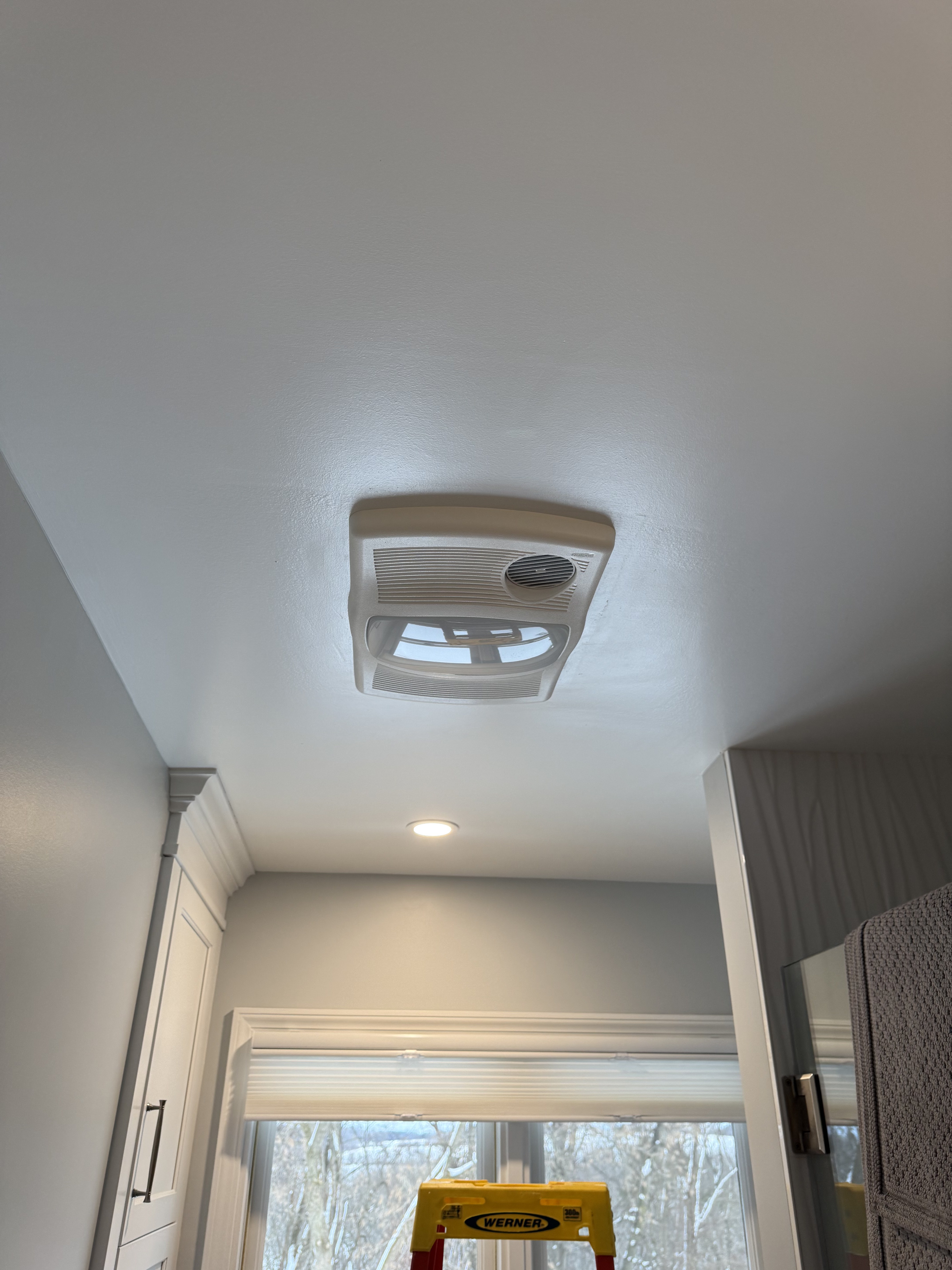 Bathroom exhaust fan heater and light combo installed in residential ceiling โ Monroe County NY, Premier Alarms and Electric