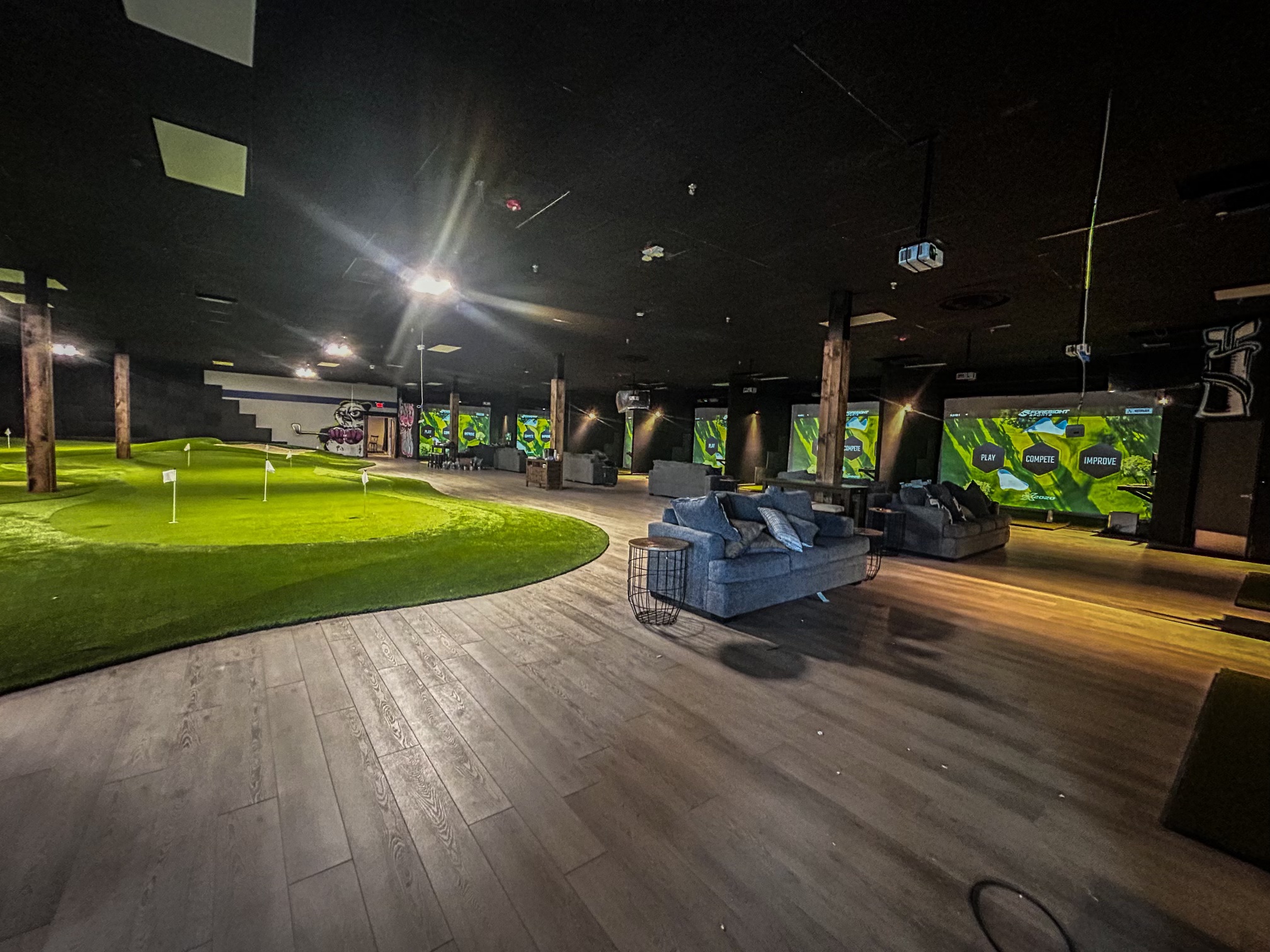 Indoor golf simulator commercial lighting installation by Premier Electric Monroe County NY