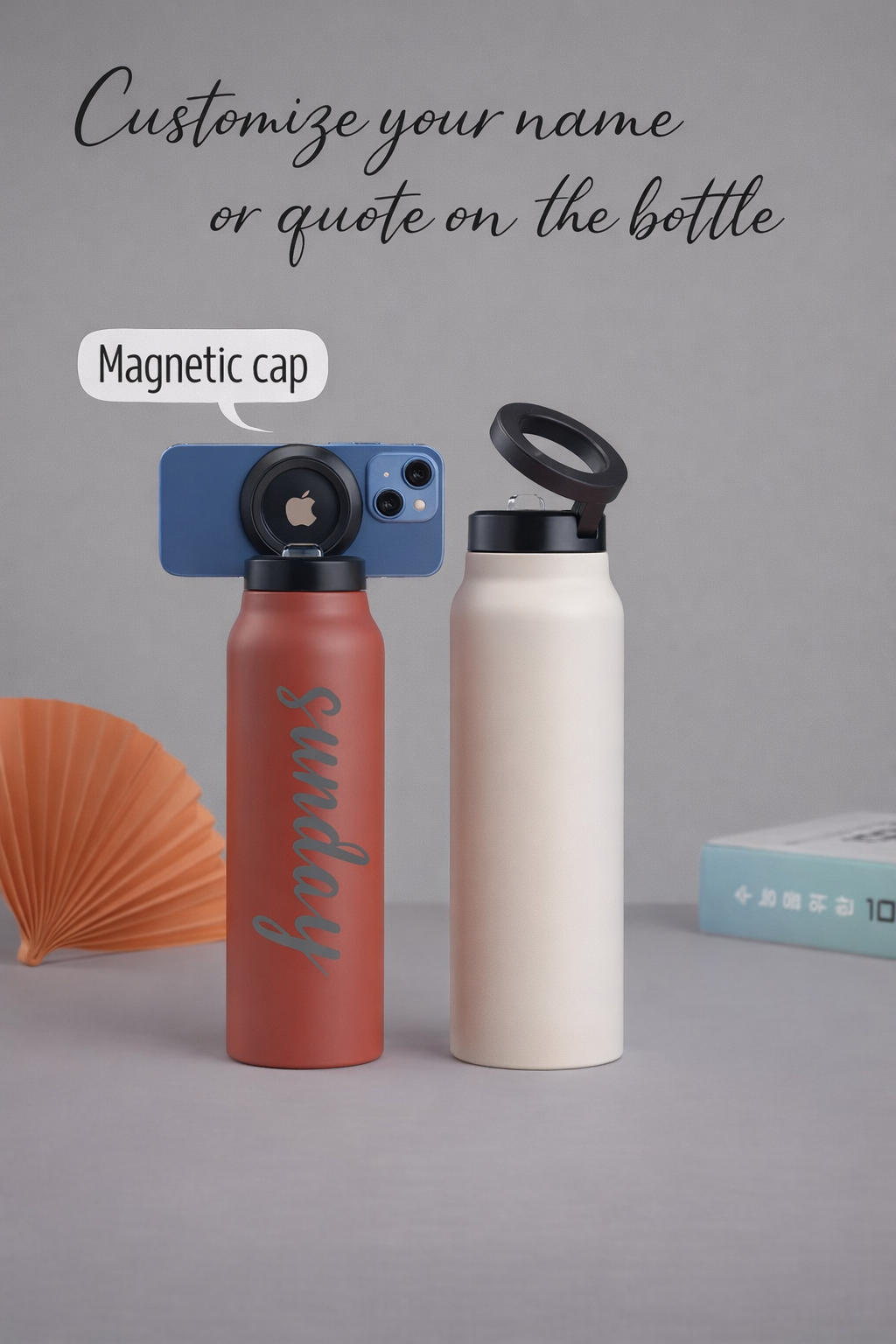 HydroMount insulated bottle with magnetic phone mount showing two bottles in coral and cream colors