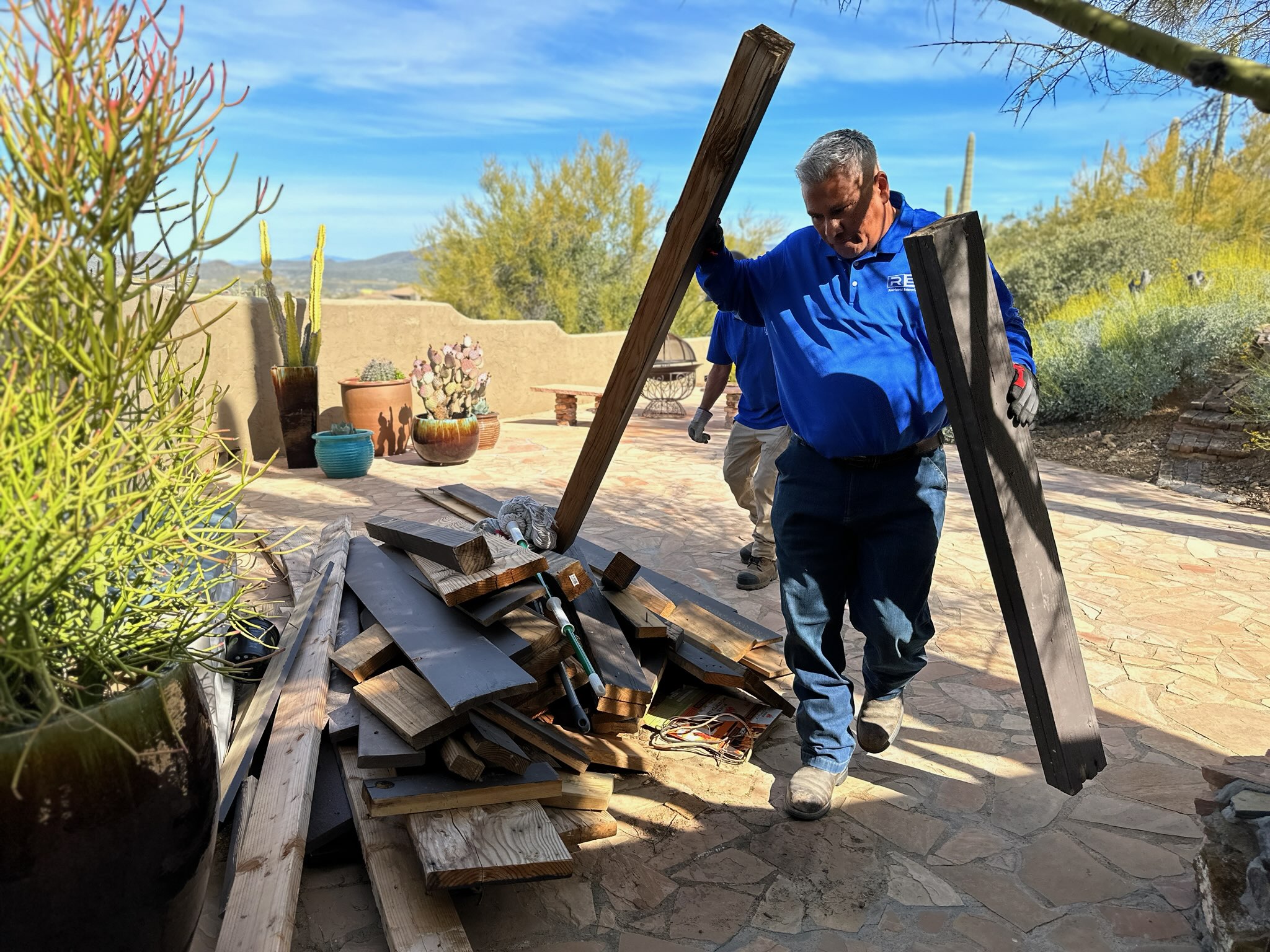 Joe Rodriguez III, owner of Rodriguez Enterprise LLC, hauling debris on the job in Arizona