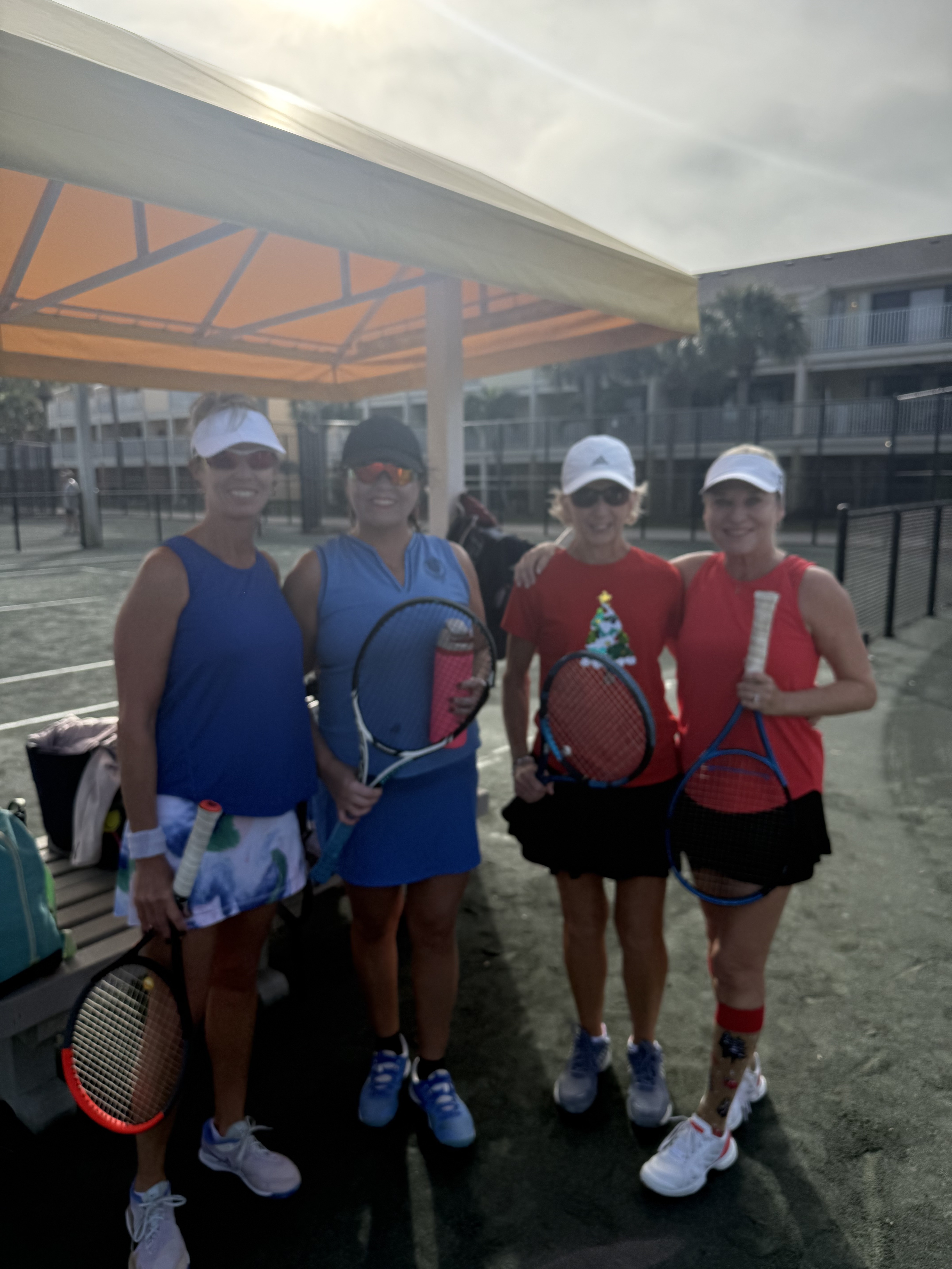 Players enjoying match play at Treasure Bay Tennis Center