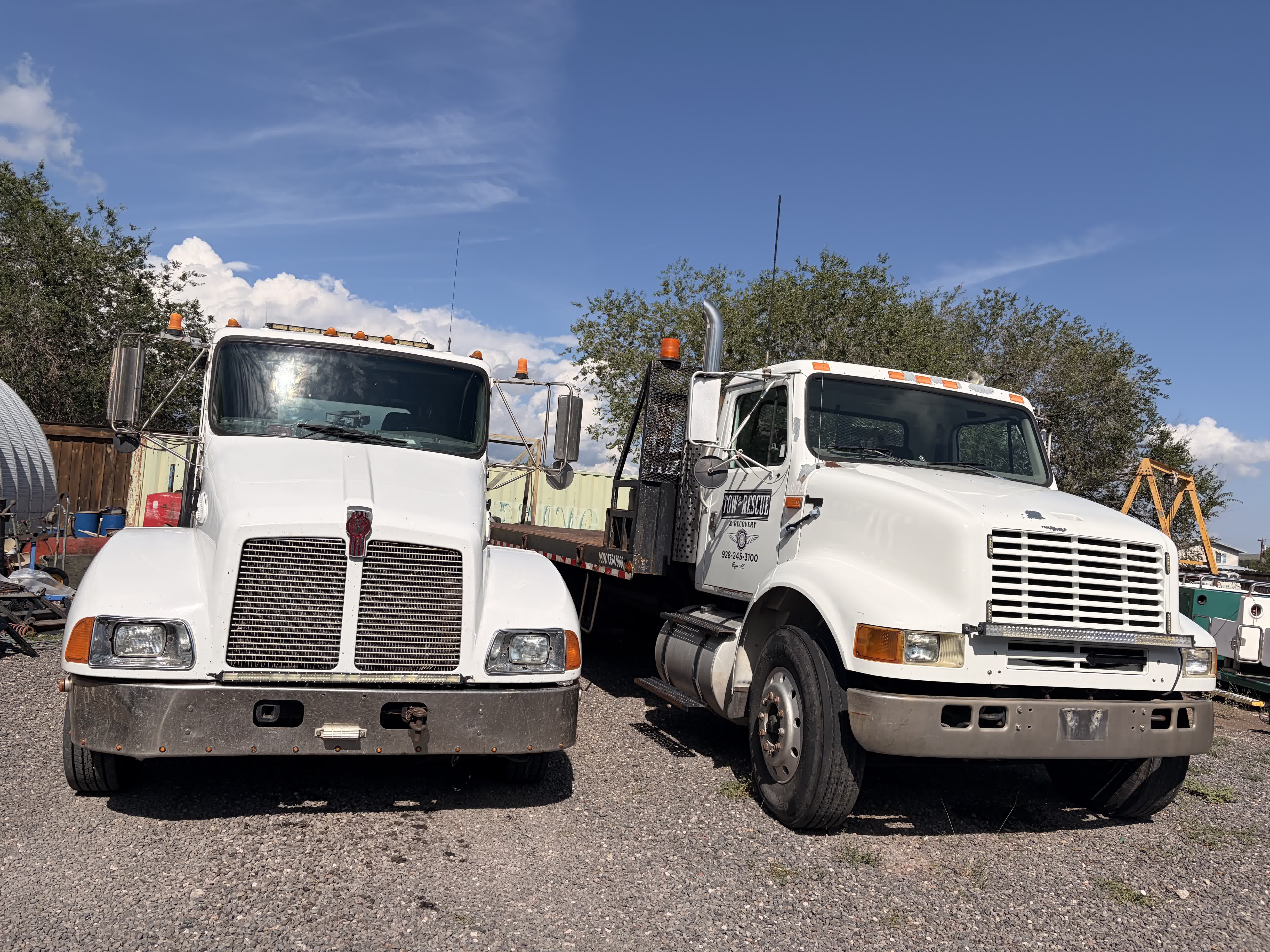 Tow to the Rescue fleet โ two flatbed tow trucks