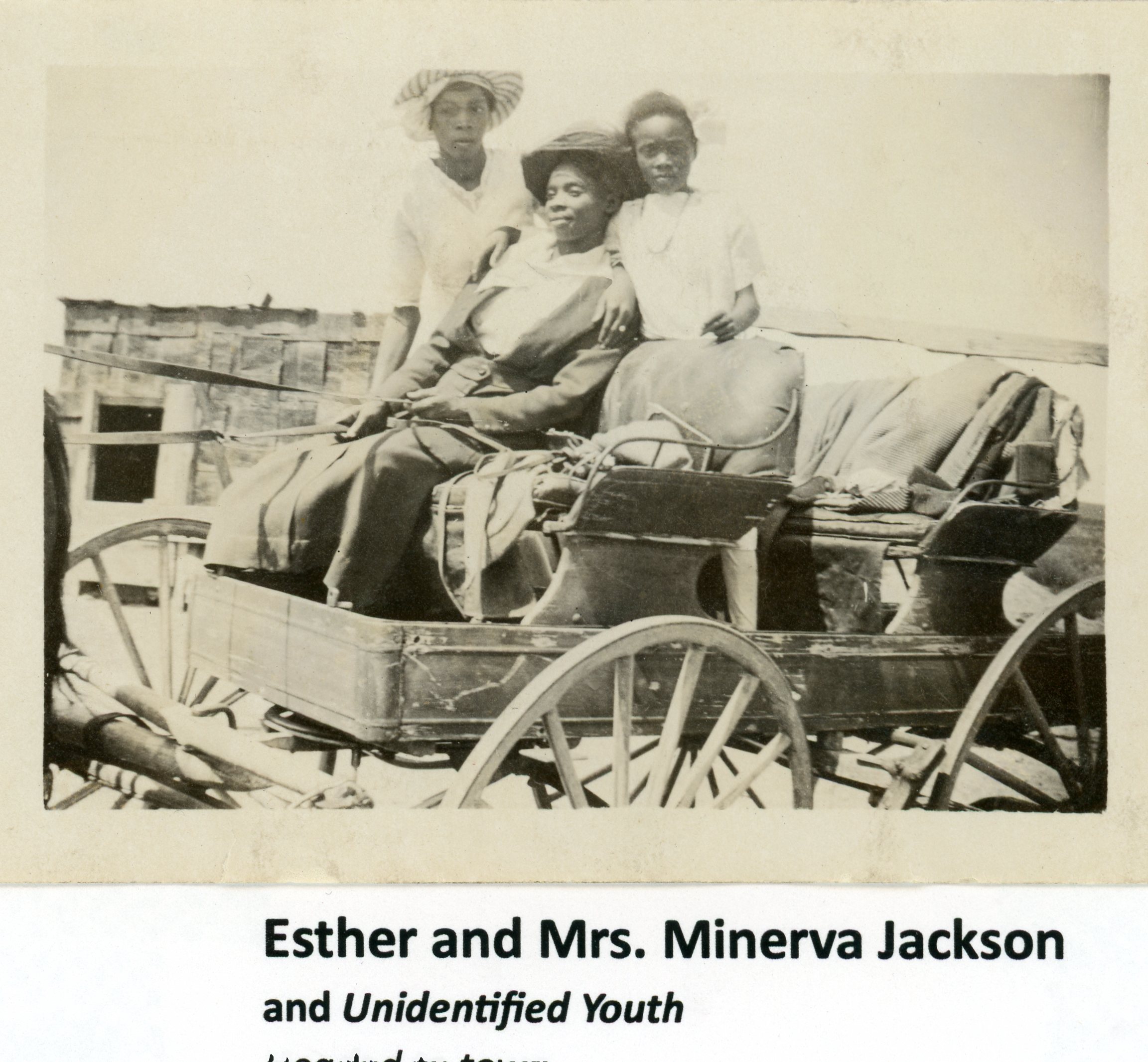 Esther Hicks and Mrs. Minerva Jackson in a horse-drawn wagon