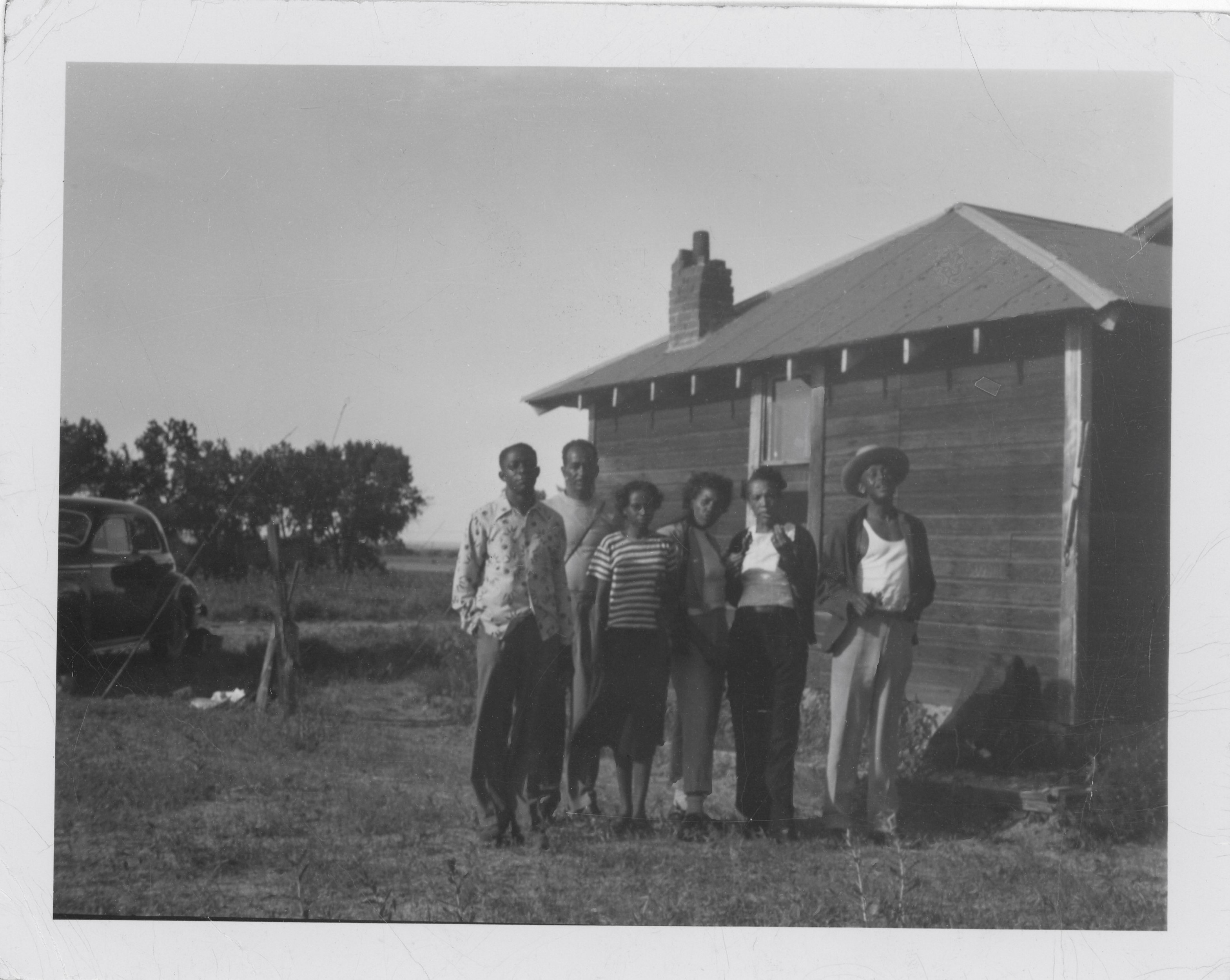 Later generations of the Hicks family gathered in front of the homestead house