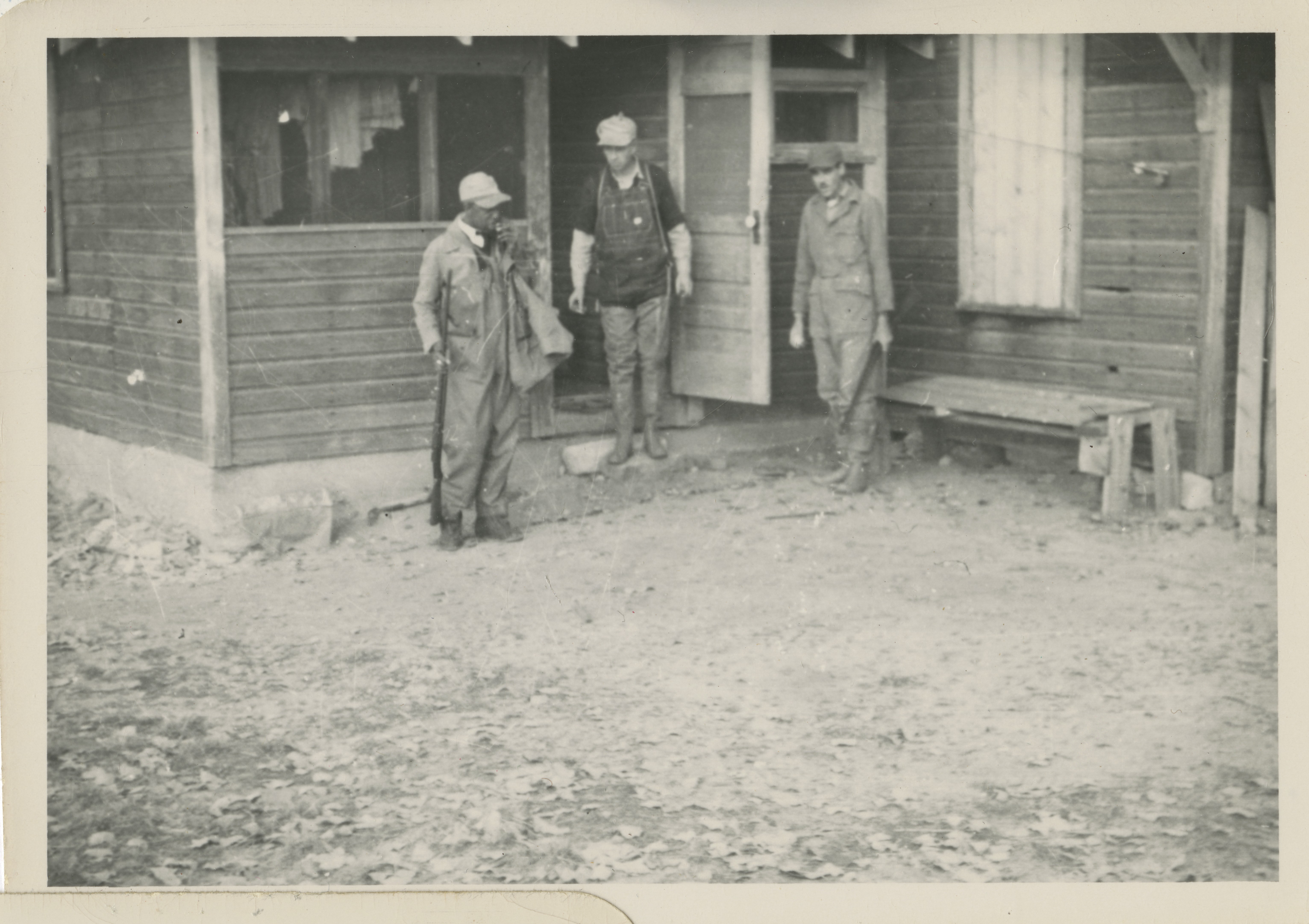 Walter Wood and hunting guides outside the homestead building