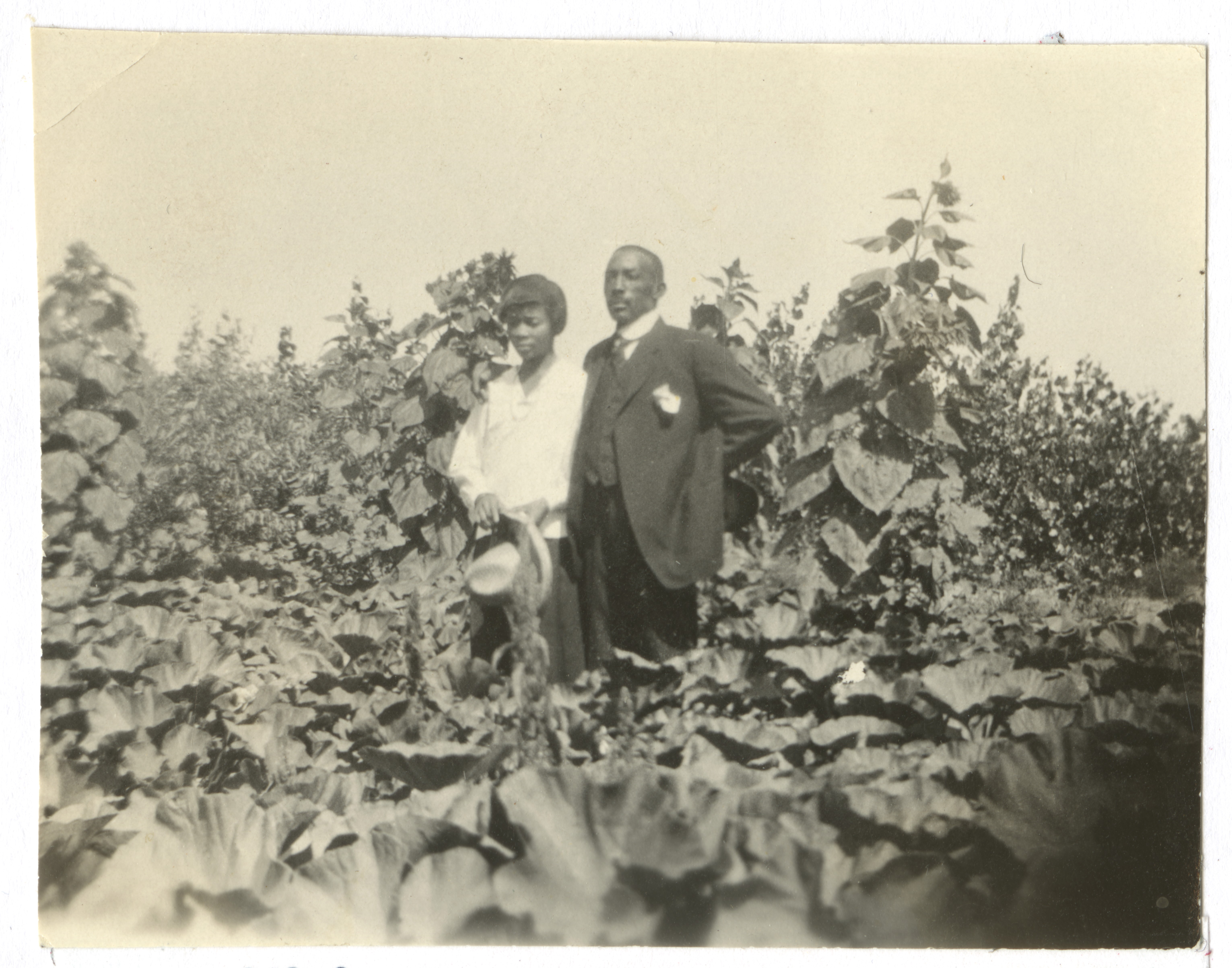Couple in the lush homestead garden