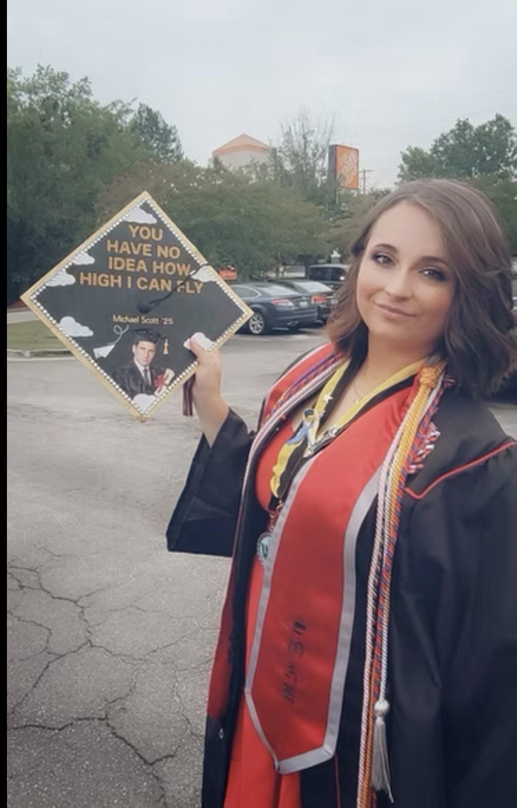 Graduate celebrating with decorated cap