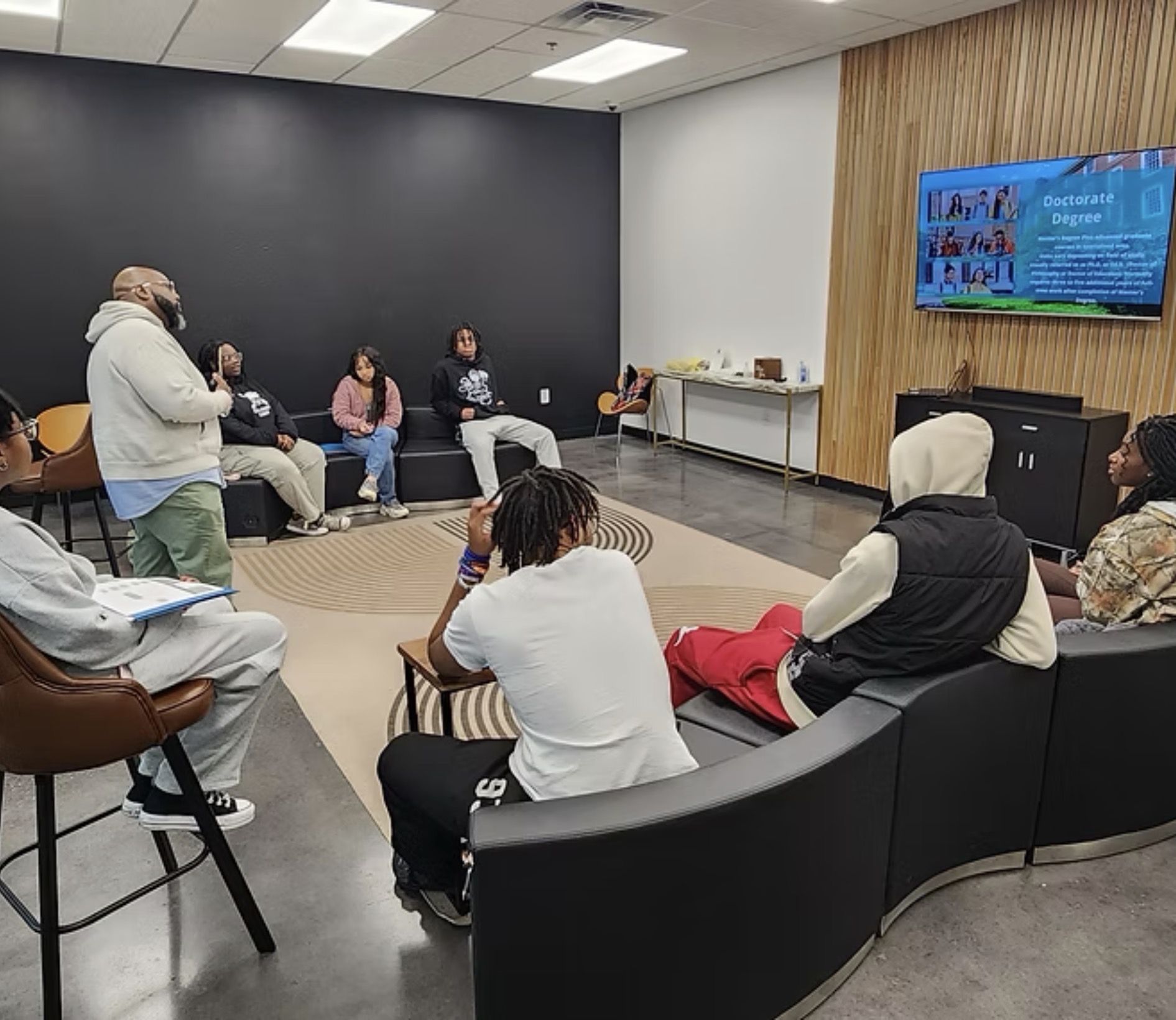 Mentorship session with youth learning about doctorate degrees