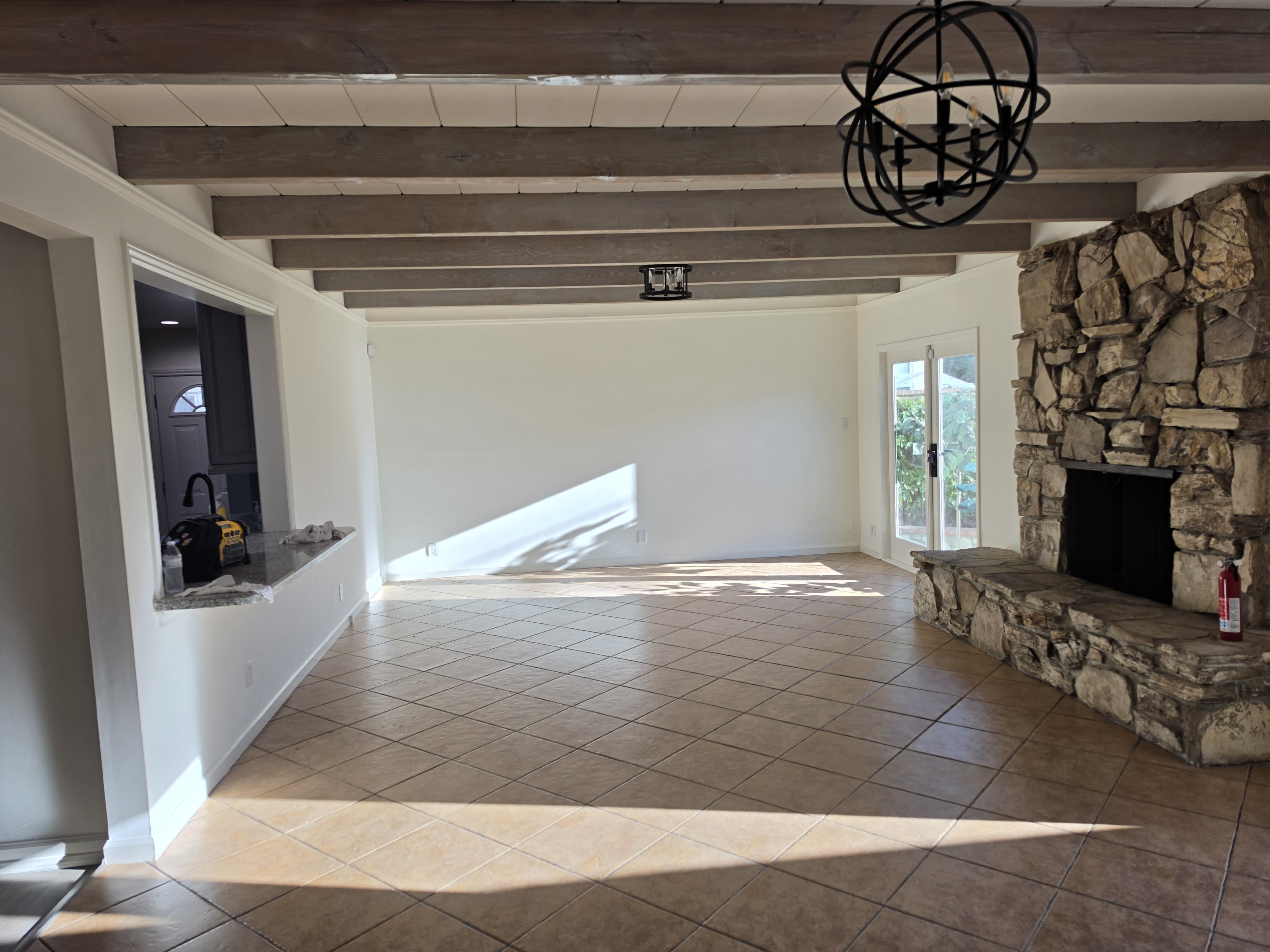Interior painting - living room with exposed beams and fireplace