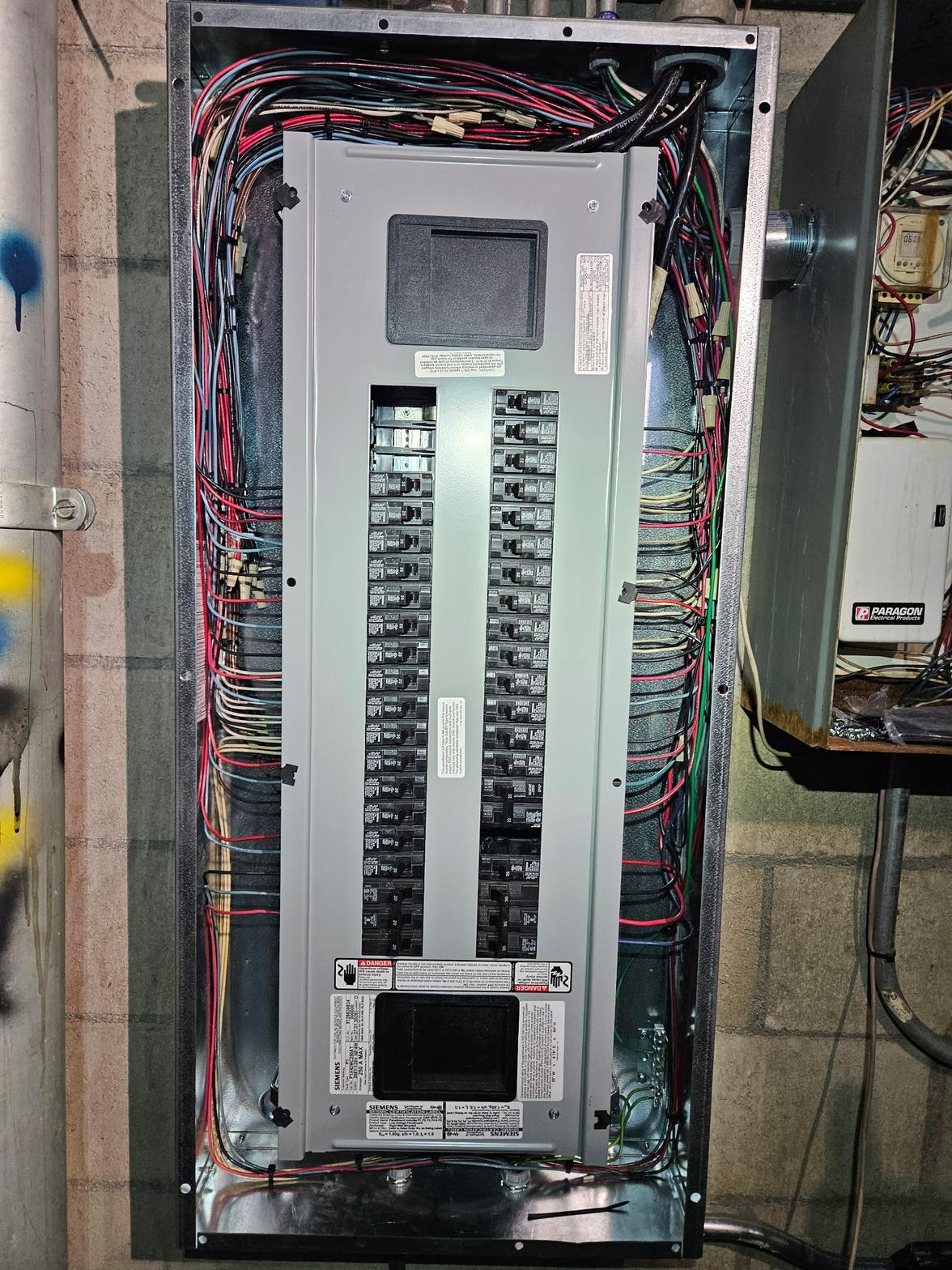 Full electrical panel with wiring — multi-unit property panel work by PMR Electrical