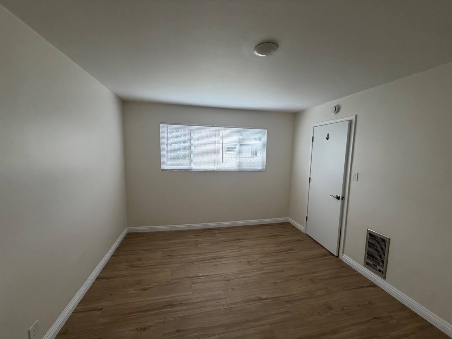 Interior painting - bedroom with hardwood floors